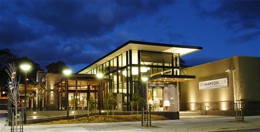 The Mawson Club building lit up at night